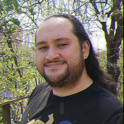 a smiling mestizo person wearing a Mastodon t-shirt.